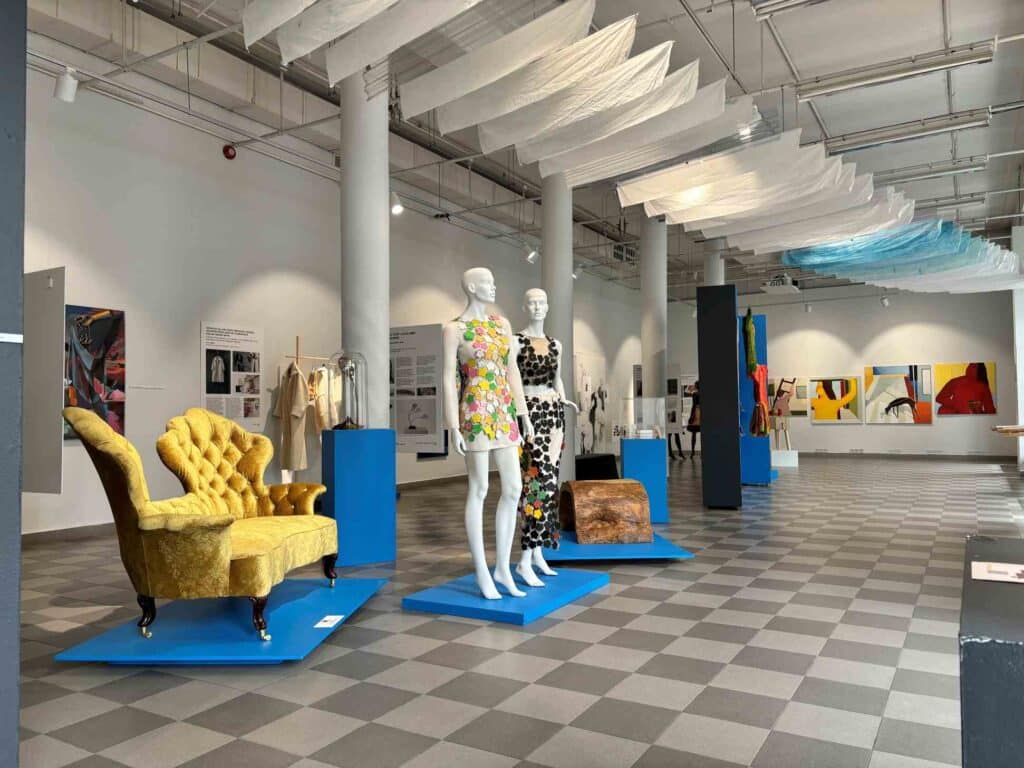 People attending an artist tour in a photography exhibition.