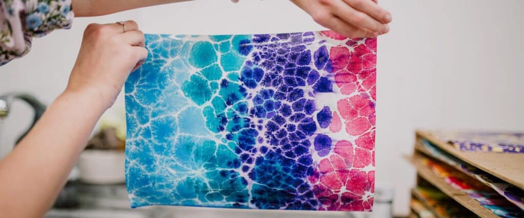 Brightly colored paper created in TYPA's marbling workshop